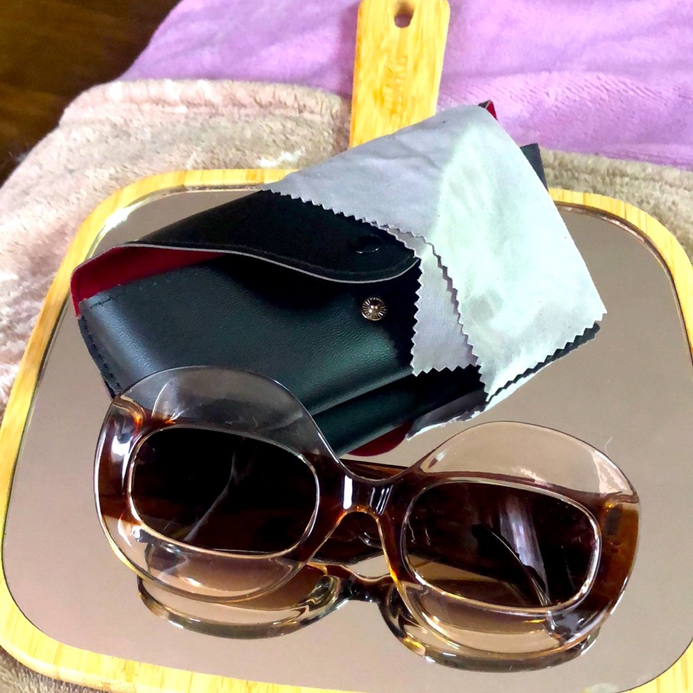 Cute, clear and brown sunglasses complete with carrying case and cleaning cloth